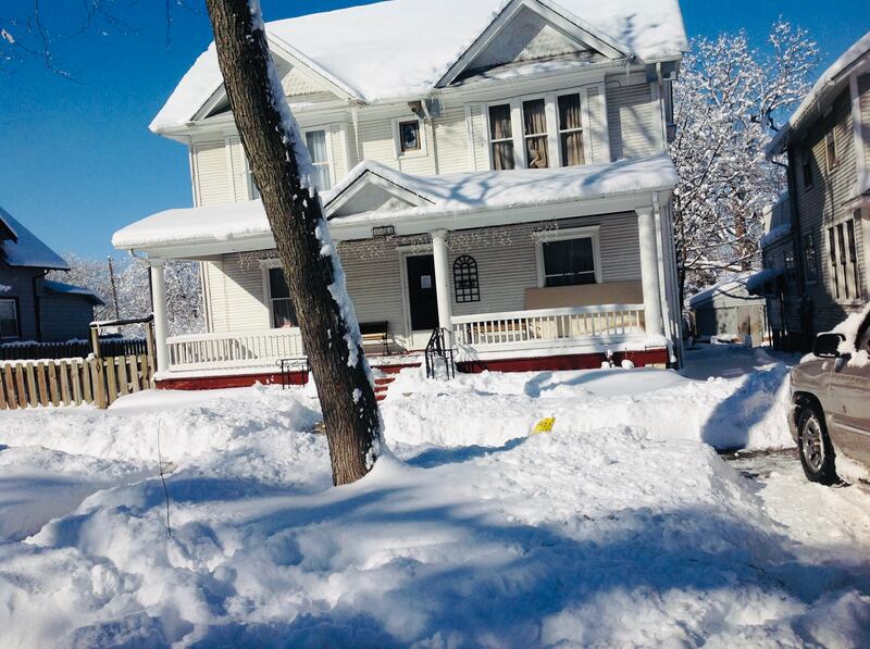 Photo of the house with four stately pillars.