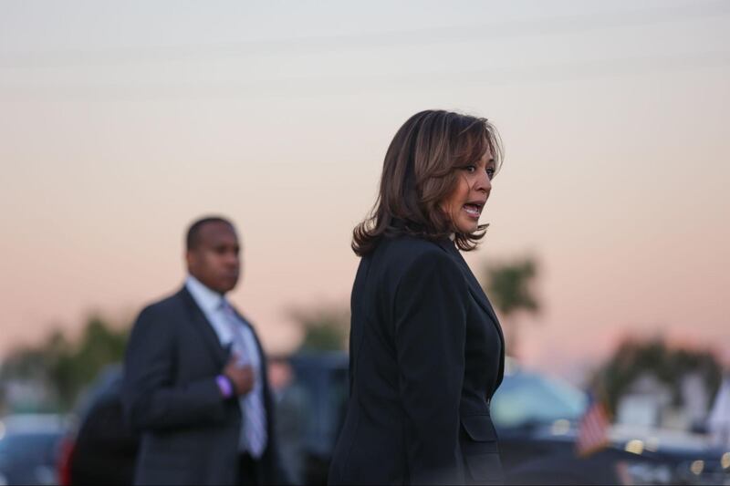 Kamala Harris brings flowers to the Monterey Park vigil after a mass shooting at a local dance studio.