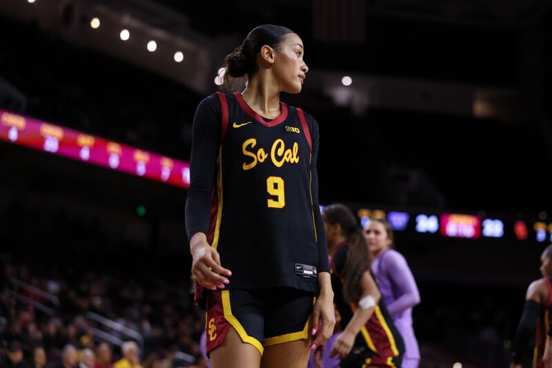 Jazzy Davidson (9) in profile wearing a black USC basketball uniform with cardinal and gold accents.