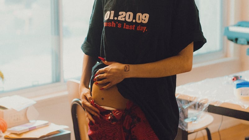 Easton shows her first tattoo she received from a friend — a small star. (Photo by Alex Lam)