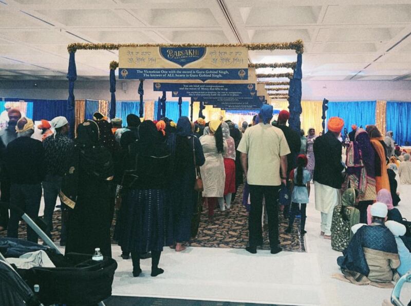 DESCRIBE THE IMAGE FOR ACCESSIBILITY, EXAMPLE: Photo of a chef putting red sauce onto an omelette.