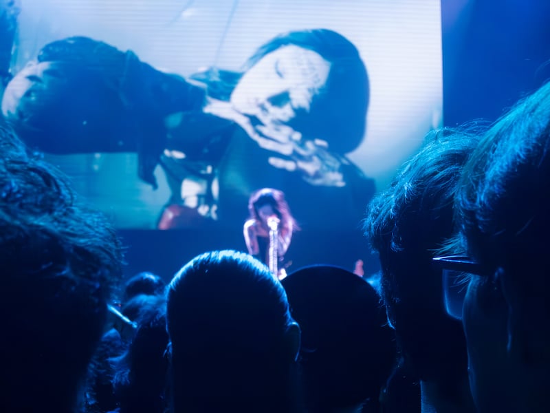 Fans watch a concert in excitement