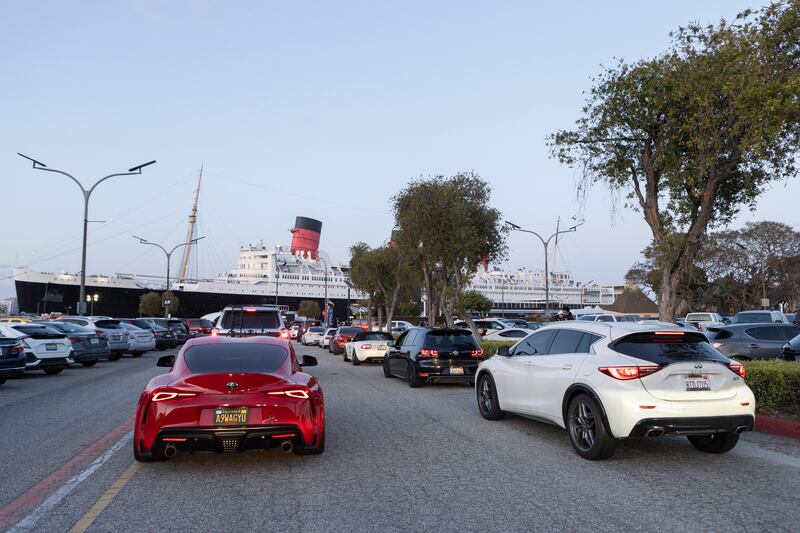 Photos of a trail of cars leading to a boat
