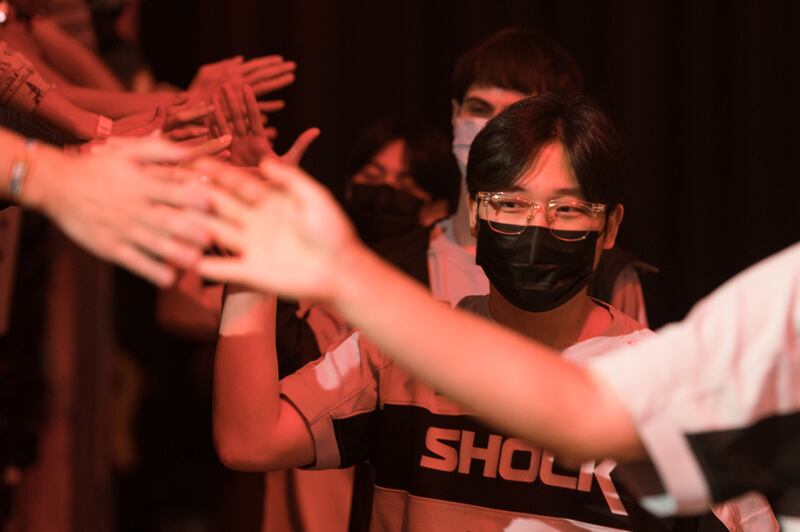 Kim "Proper" Dong-hyun, damage player for the San Francisco Shock, high-fives fans while walking out for the grand finals. Proper became notorious during the playoffs for single-handedly winning fights with his stellar performance on damage characters. He swept the postseason awards, bagging the Most Valuable Player (MVP), Rookie of the Year and Role Star awards. (Photo by Michael Chow)