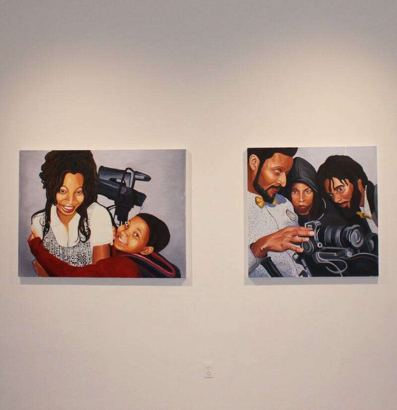 Two oil paintings from Zoe James MacDonald’s “Unfinished Sentences” at Helen Lindhurst Fine Arts Gallery depict Kamisha Thomas receiving her first video camera as a child and using one as an adult. (Photos courtesy of Zoe James MacDonald)
