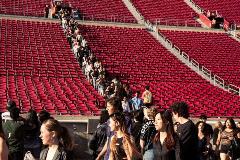 Students descend toward the Coliseum floor, with long steps ahead and anticipation in the air. (Photo by Marissa Ding)
