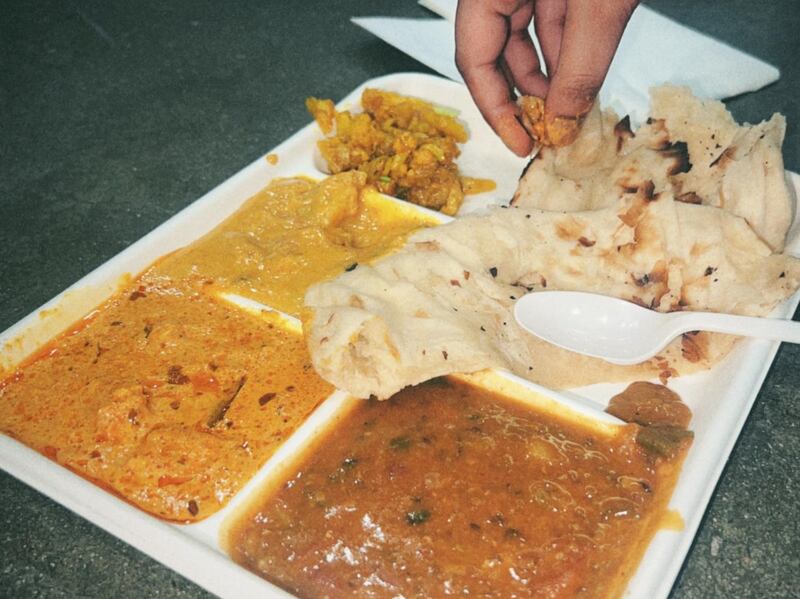 DESCRIBE THE IMAGE FOR ACCESSIBILITY, EXAMPLE: Photo of a chef putting red sauce onto an omelette.