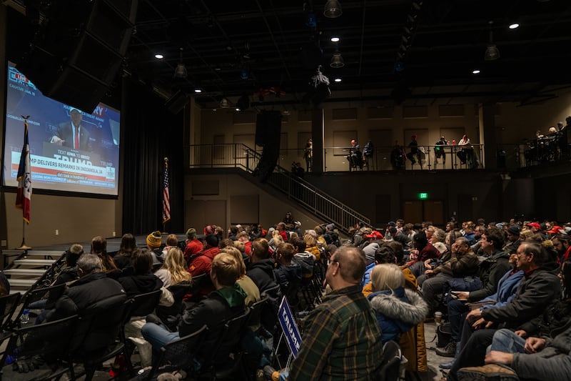 Crowd of people watching former President Donald Trump