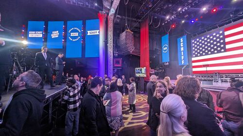 Crowds gather near the stage to cheer on Schiff's projected wins at the AVALON.
