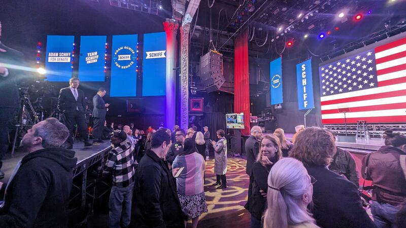Crowds gather near the stage to cheer on Schiff's projected wins at the AVALON.