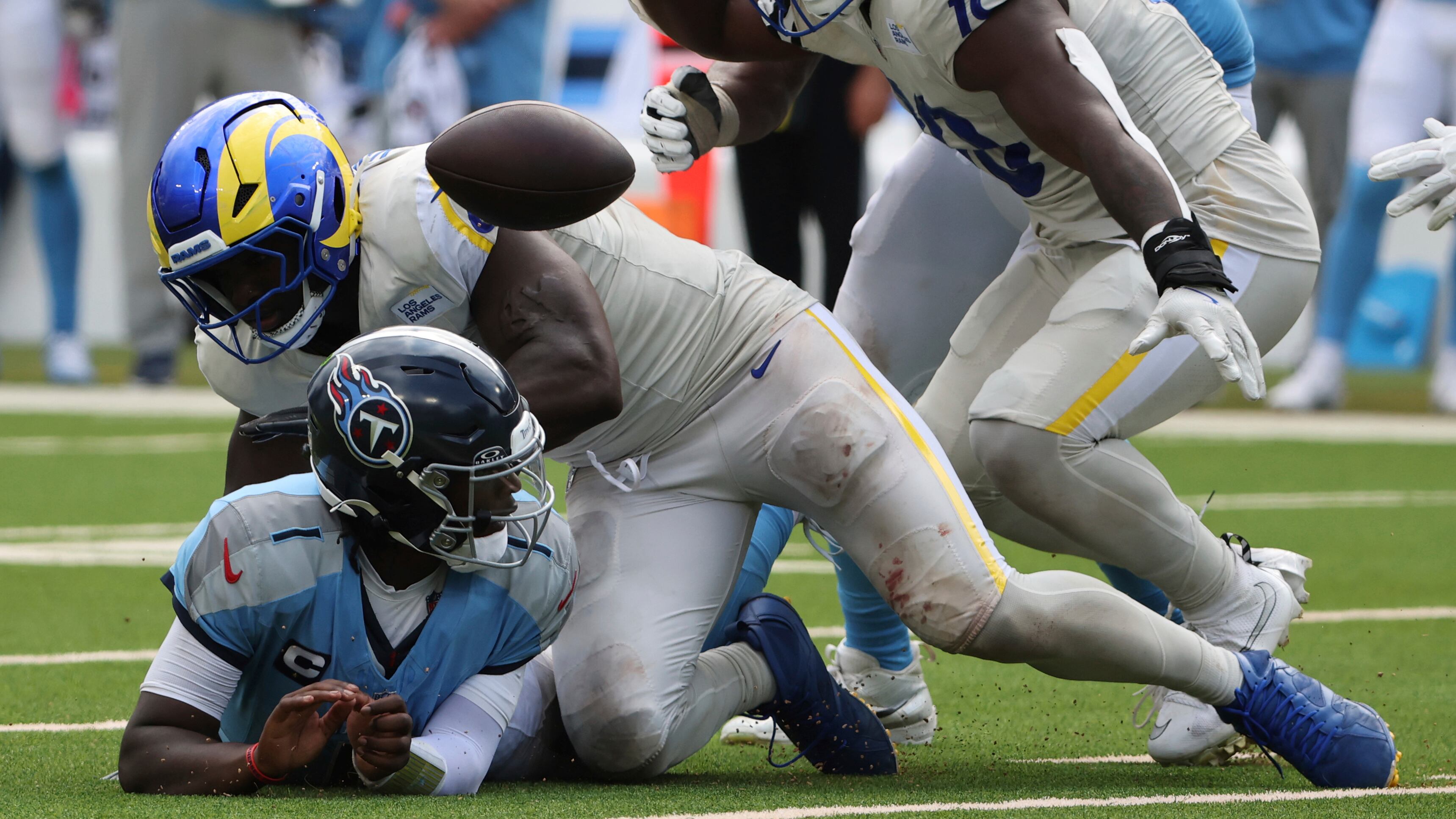 Bryon Young strip sacks Cam Ward.