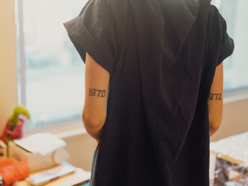 Easton shows one of her tattoos with personal meaning: her parents' birth years. (Photo by Alex Lam)