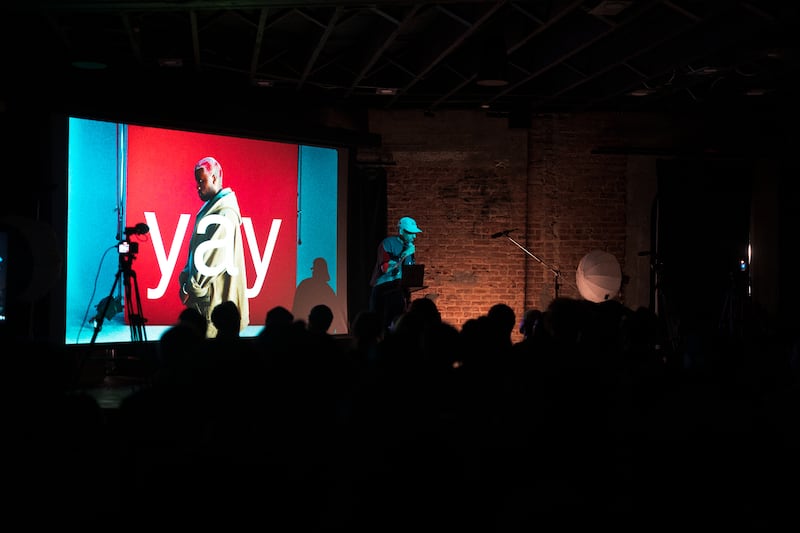 DESCRIBE THE IMAGE FOR ACCESSIBILITY, EXAMPLE: Photo of a chef putting red sauce onto an omelette.