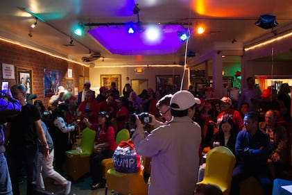 DESCRIBE THE IMAGE FOR ACCESSIBILITY, EXAMPLE: Photo of a chef putting red sauce onto an omelette.