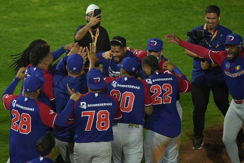 Photo of Dominican baseball players celebrating.