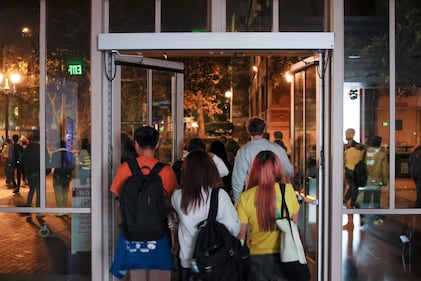 DESCRIBE THE IMAGE FOR ACCESSIBILITY, EXAMPLE: Photo of a chef putting red sauce onto an omelette.