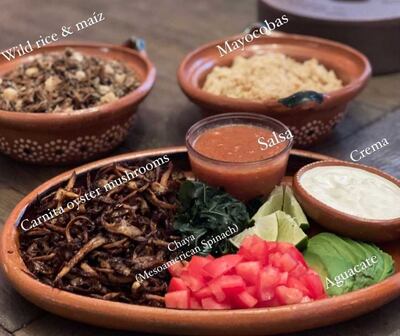 Photo of traditional dishes such as salsa, mushrooms, and wild rice handmade by Claudia Serrato