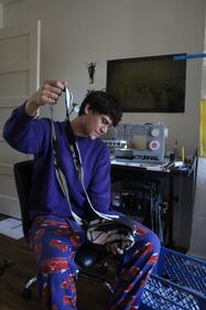 Photo of Thomas with a handmade bag.