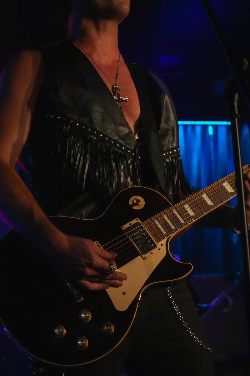 Musician with guitar.