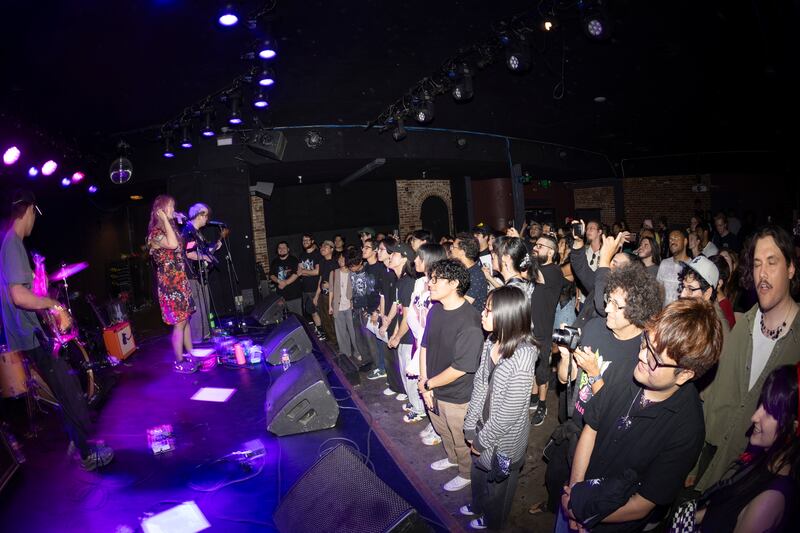 Crowd cheers a band