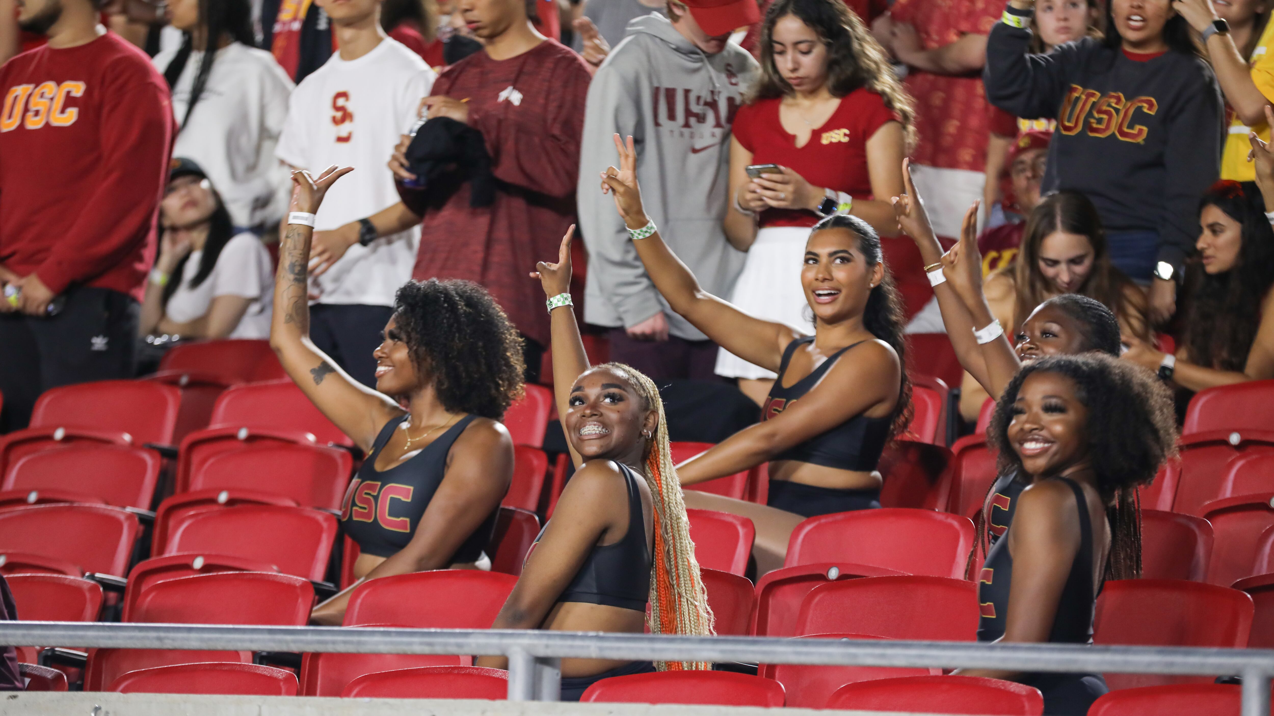 A photo of the Cardinal Divas of SC performing in the stands.