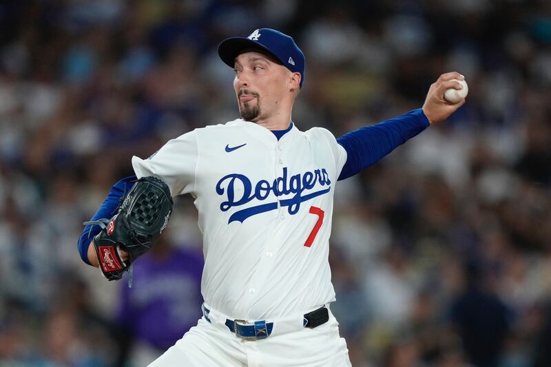 Photo of a Dodgers baseball player throwing a pitch.