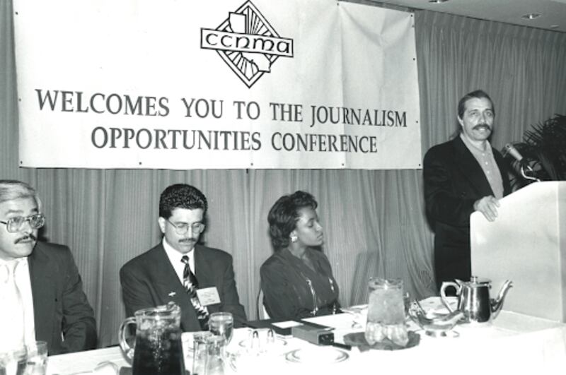 DESCRIBE THE IMAGE FOR ACCESSIBILITY, EXAMPLE: Photo of a chef putting red sauce onto an omelette.