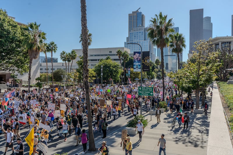 Demonstrators march down Grand Avenue.