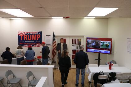 The Trump HQ watch party and potluck in Long Beach watches the Fox News Live election coverage.