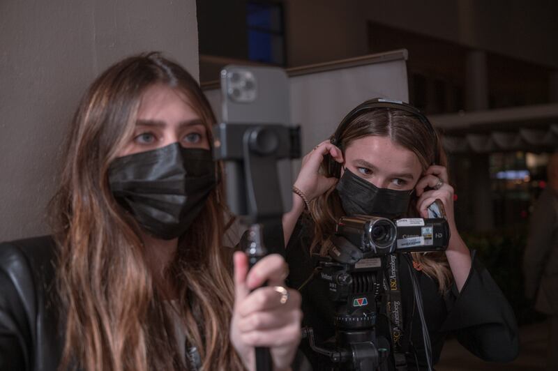 Multimedia Journalists Jocelyn Stone and Tess Patton set up cameras to cover the "Squid Game" Red Carpet event hosted by Netflix at NeueHouse Hollywood on 8 Nov 2021.