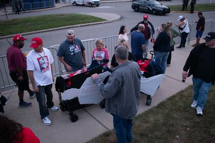 DESCRIBE THE IMAGE FOR ACCESSIBILITY, EXAMPLE: Photo of a chef putting red sauce onto an omelette.