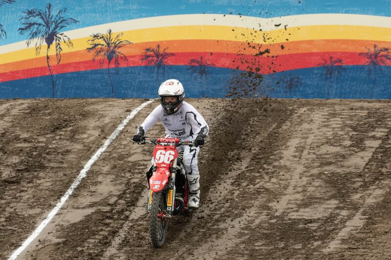 Chris Blose comes down the dirt ramp at the start of the Straight Rhythm course, kicking up dirt during the qualifying races.