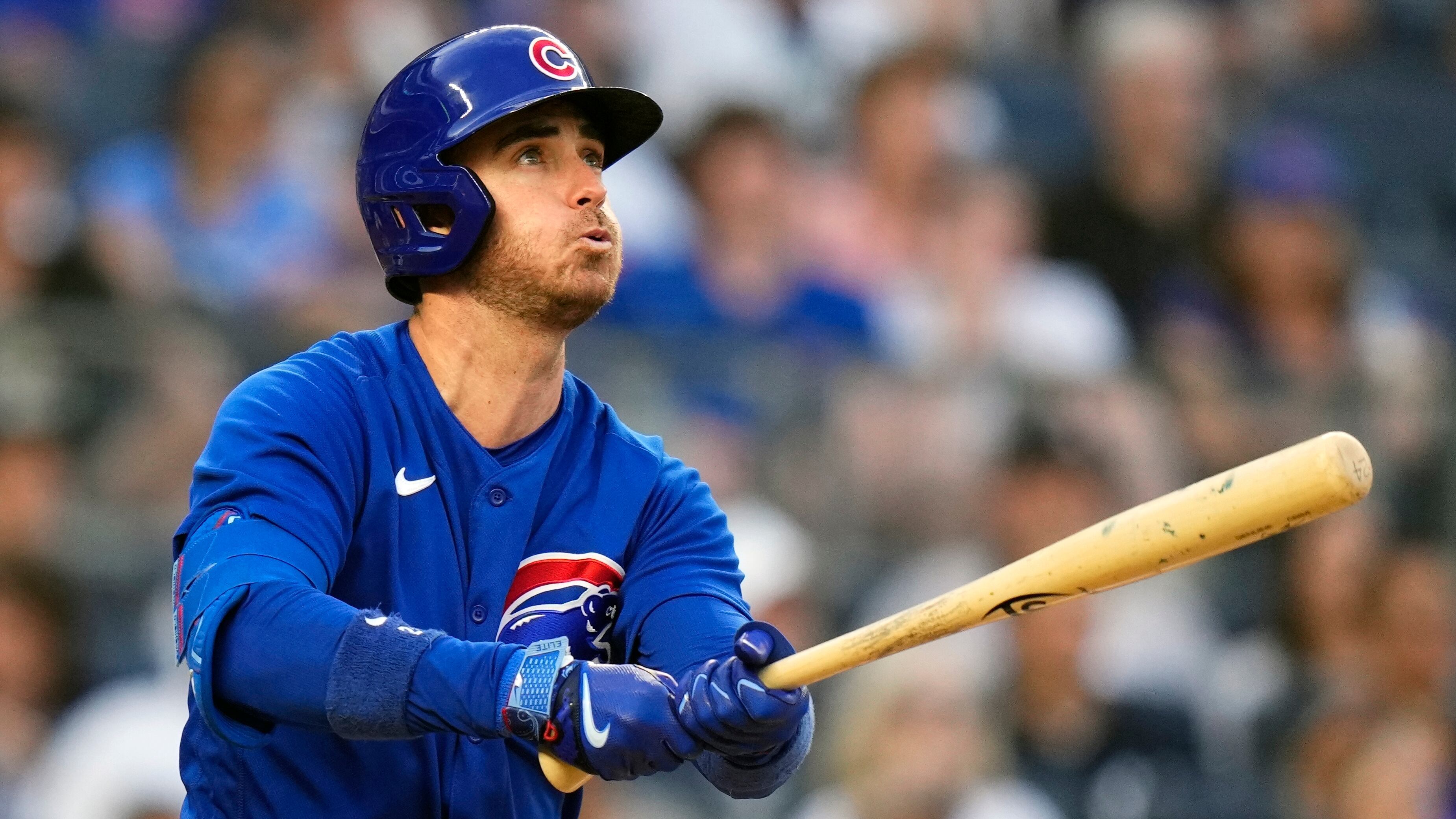 Current free agent Cody Bellinger takes at an at-bat for the Chicago Cubs, wearing a Cubs blue jersey and helmet.