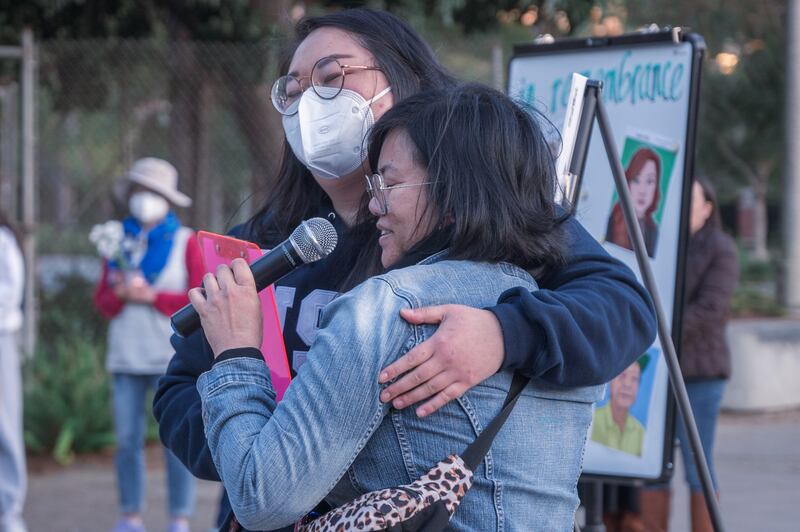 Organizers Jasmine Yu (left) and Katherine Guevarra (right), co-vice chairs of the USC APIFSA programming and events committee, share a hug after the vigil. “It has been an extremely difficult year for [APIDA],” said Guevarra as she teared up. “I am extremely touched by the show of solidarity by members and allies of the community.”