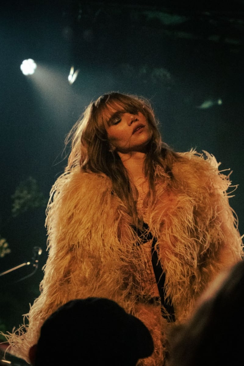 Suki Waterhouse in concert.