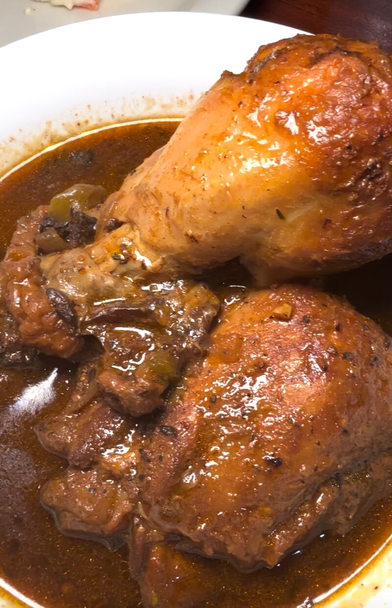 Photo of a stewed chicken in a bowl.