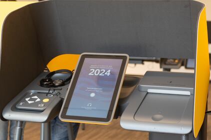 DESCRIBE THE IMAGE FOR ACCESSIBILITY, EXAMPLE: Photo of a chef putting red sauce onto an omelette.