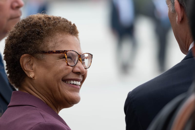 City of L.A. mayoral candidate and U.S. Rep. Karen Bass talks with Los Angeles Mayor Eric Garcetti as the group waits to greet Joe Biden.