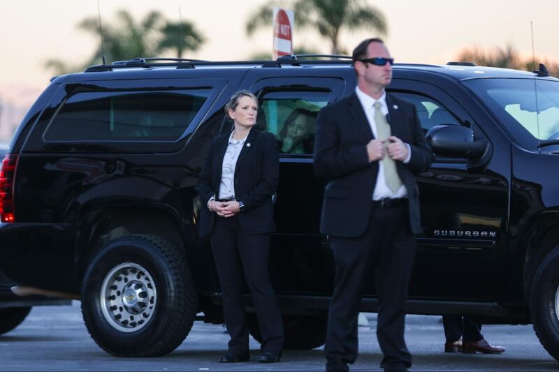 Kamala Harris brings flowers to the Monterey Park vigil after a mass shooting at a local dance studio.