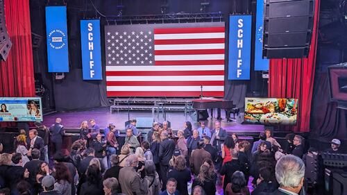 Reporters and supporters eagerly anticipate Adam Schiff's arrival after the AP called California's for him.