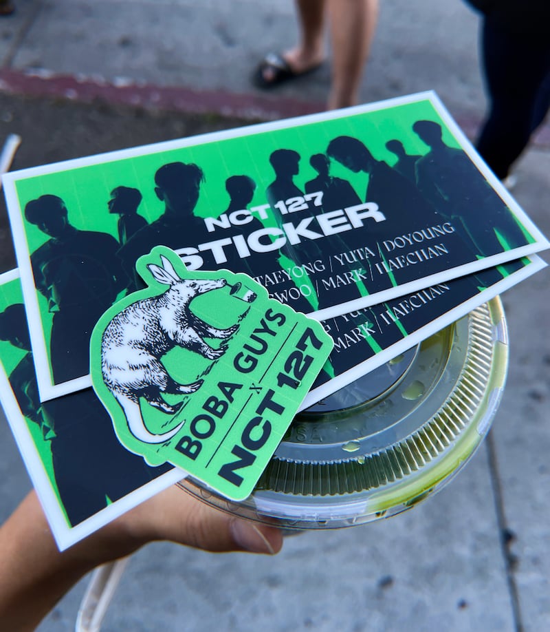 A photo of the stickers and boba given out at the pop-up event.