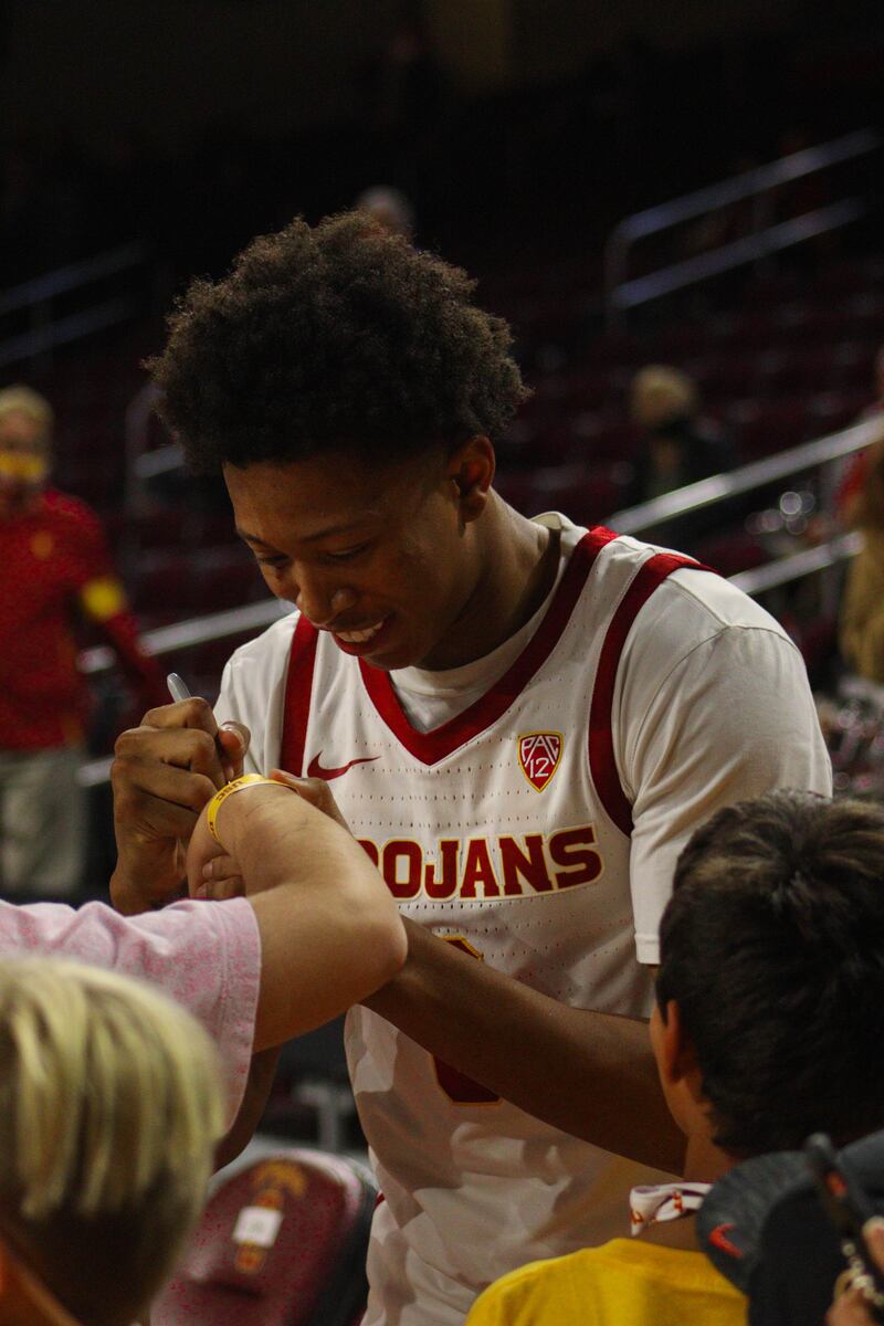 Boogie Ellis signs autographs for fans following USC's season-opening win over Cal State Northridge.