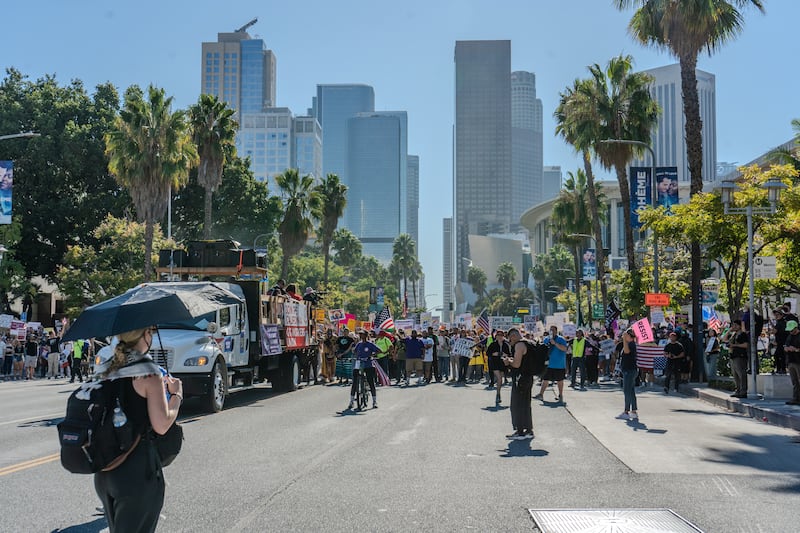 Demonstrators march down Grand Avenue.