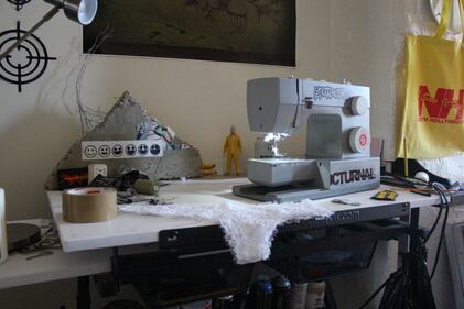 Photo of a table with a sewing machine on it.