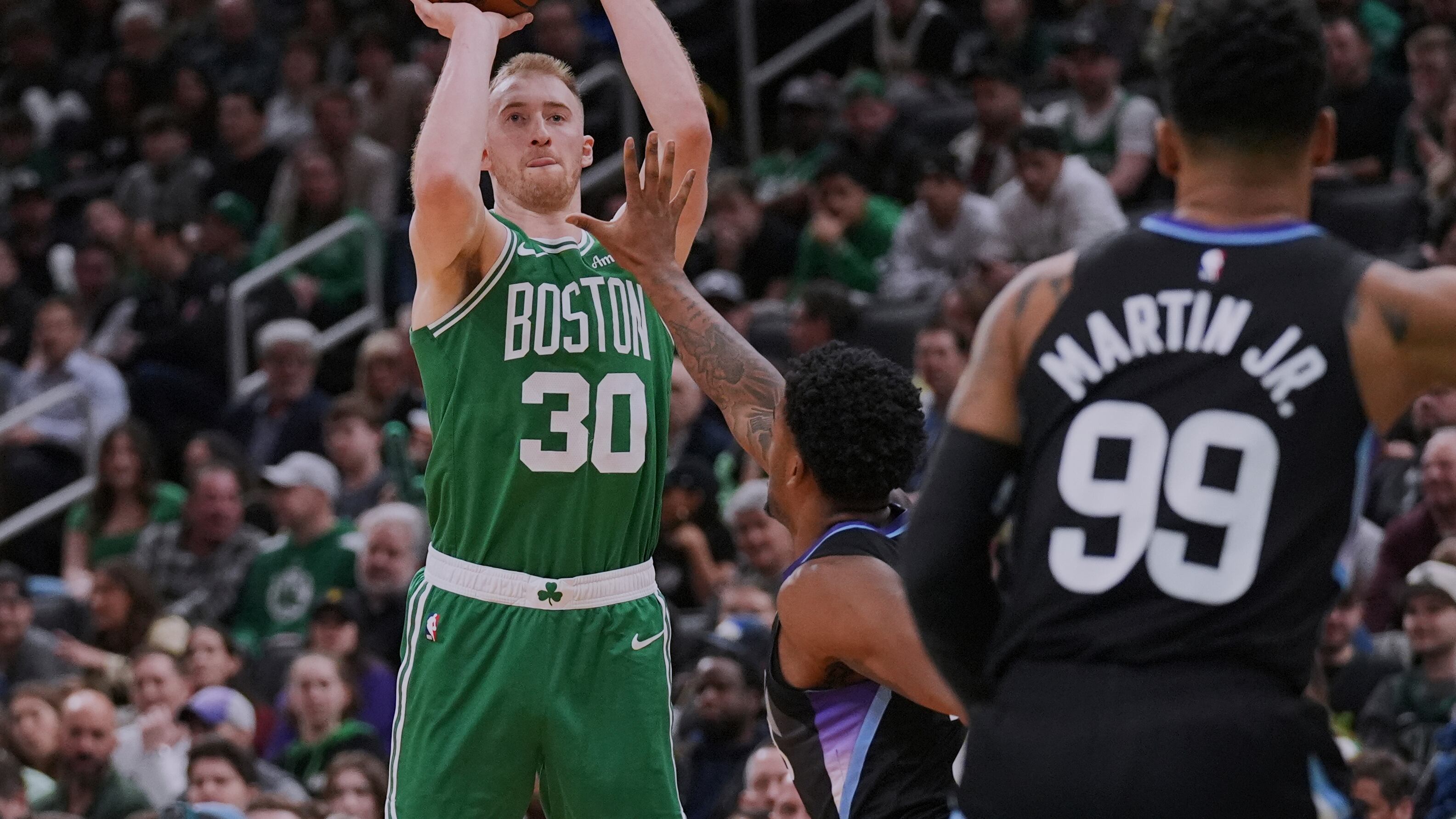 Boston Celtics forward Sam Hauser (30) takes a 3-point shot against the Utah Jazz during the second half of an NBA basketball game, Monday, March 10, 2025, in Boston. (AP Photo/Charles Krupa)