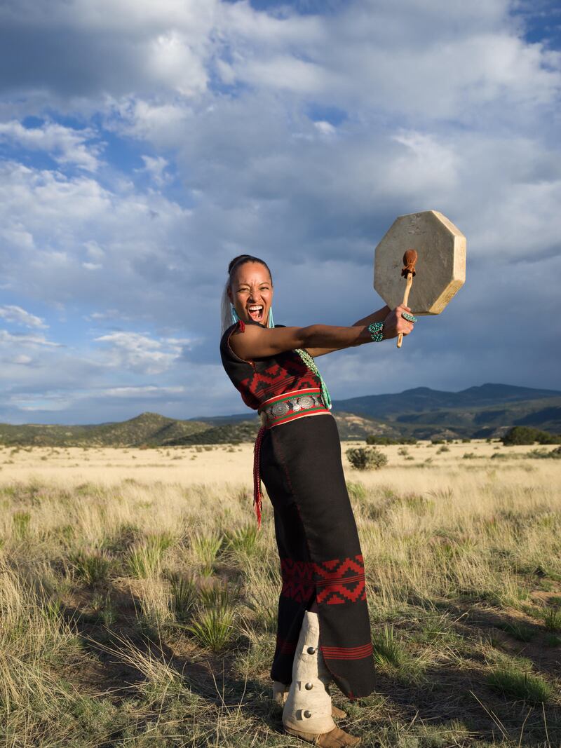 Radmilla Cody playing drum