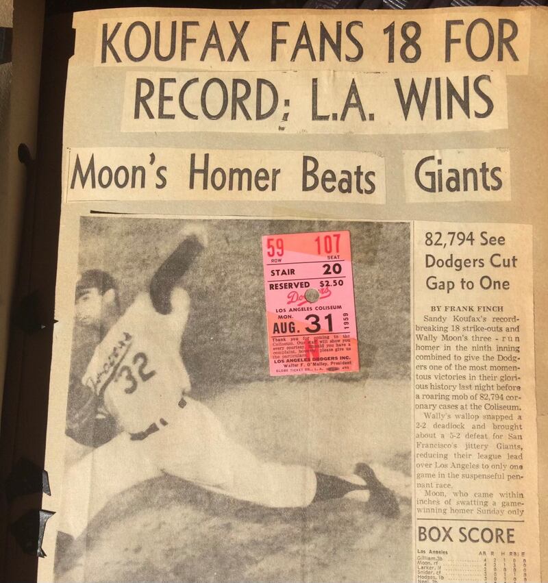 Photo of a game ticket and newspaper clipping.