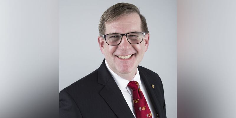 Headshot of James Moore.