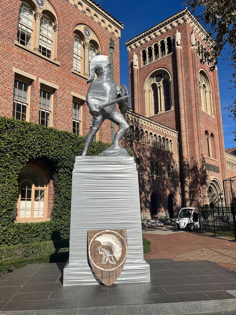 Statue of a warrior on a large platform wrapped in duct tape