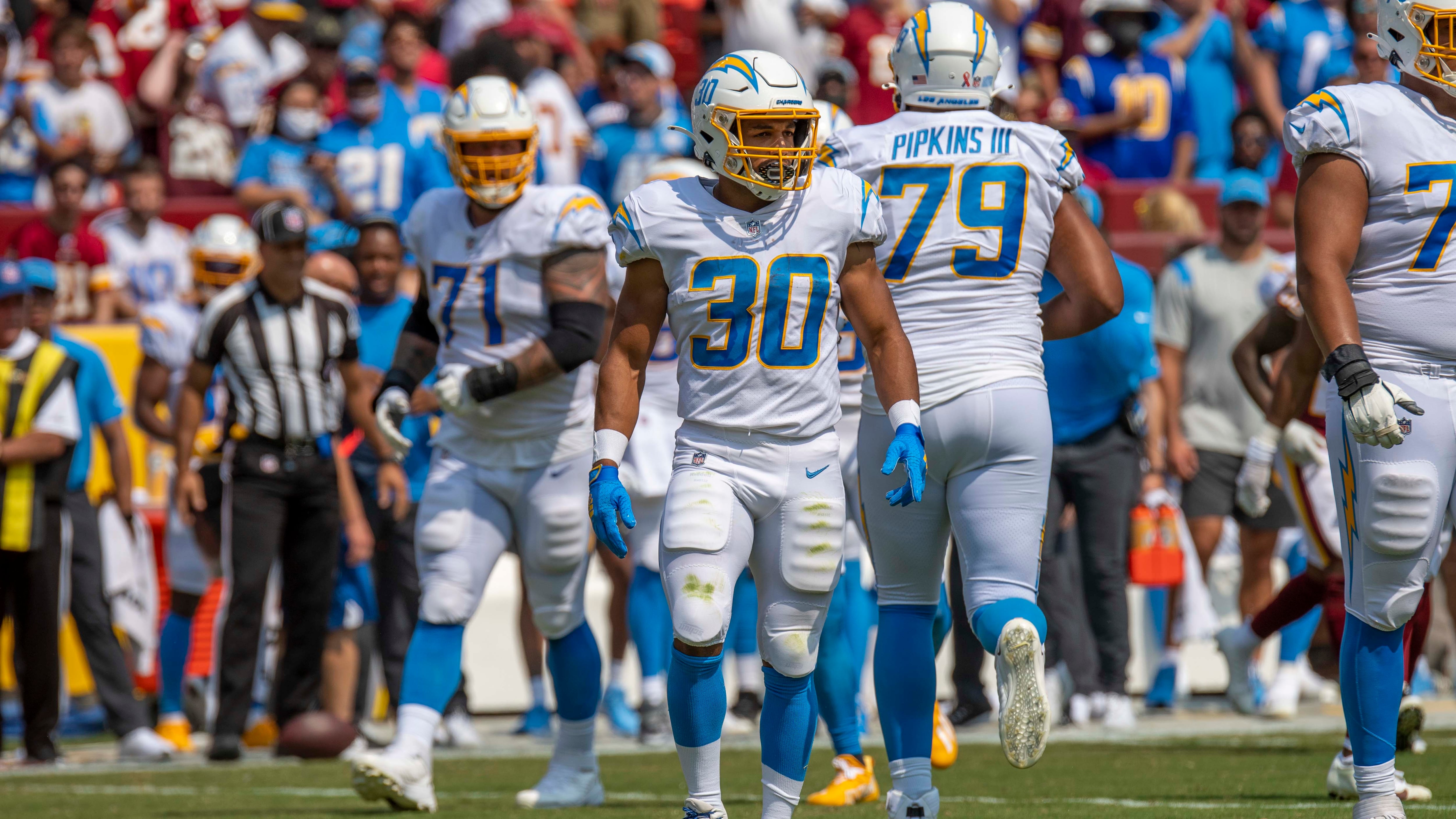 DESCRIBE THE IMAGE FOR ACCESSIBILITY, EXAMPLE: Photo of a chef putting red sauce onto an omelette.